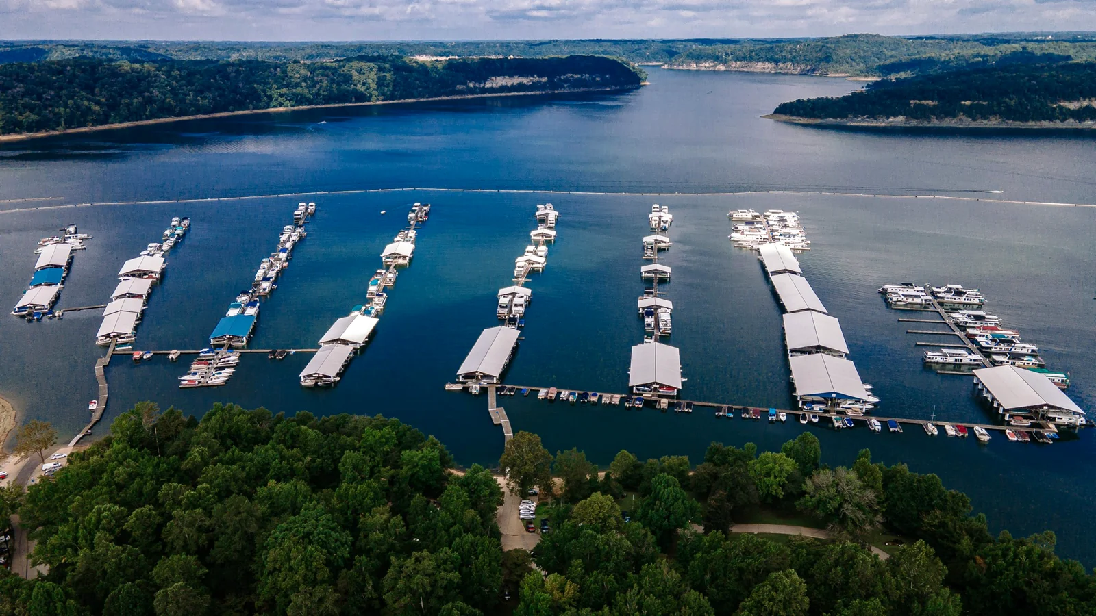 Conley Bottom on Lake Cumberland near Monticello Kentucky — marina docks, forested hills, and lake vacation scenery